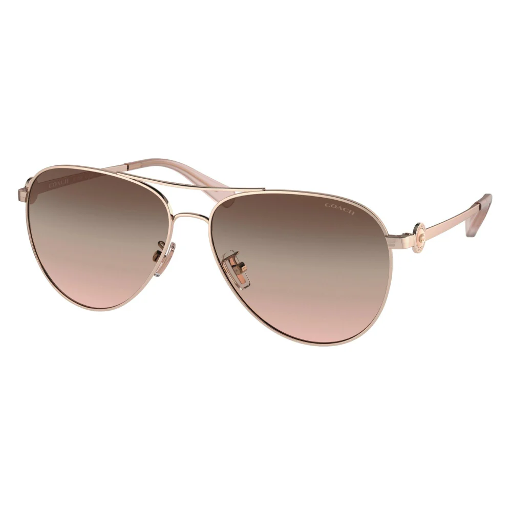 These Coach 0HC7128 shiny rose gold sunglasses have an aviator style and a brown pink gradient lens color.